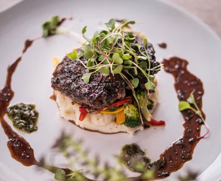 A plated dish garnished with fresh herbs
