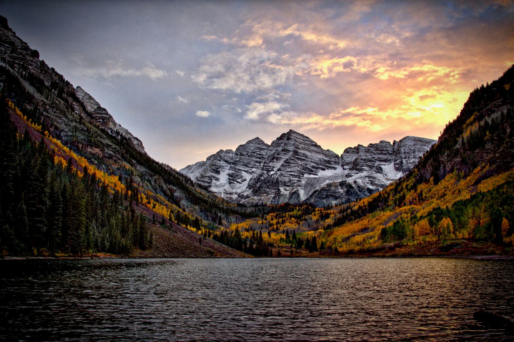 The Maroon Bells near Aspen at sunset, above Maroon Lake and autumn aspens