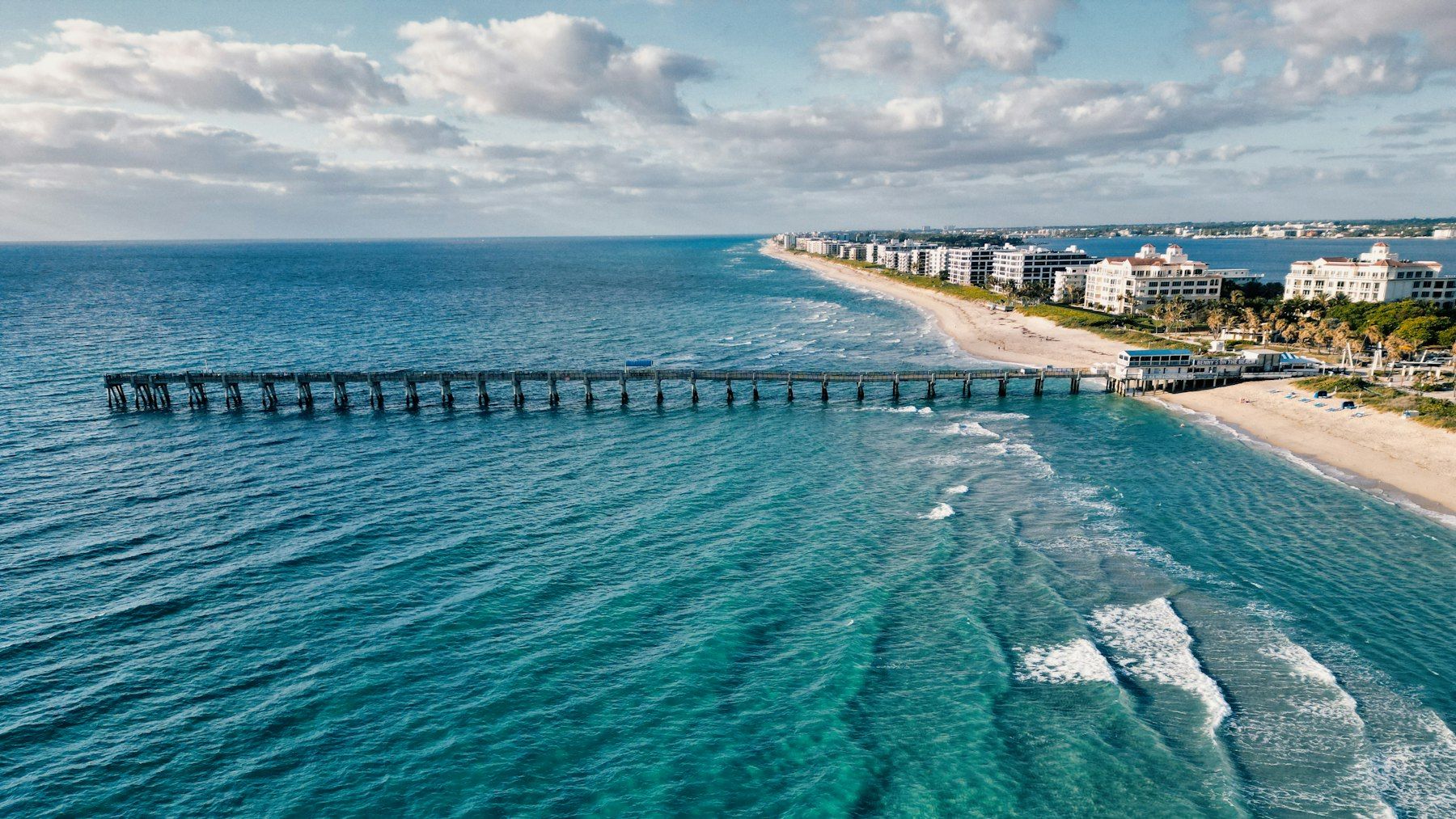Aerial view of the Lake Worth Beach pier and the Palm Beach County coastline